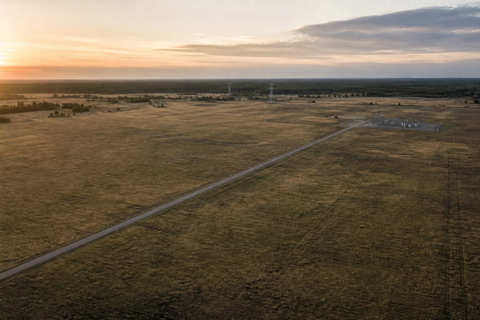 AI-generated illustration of open land near electrical infrastructure